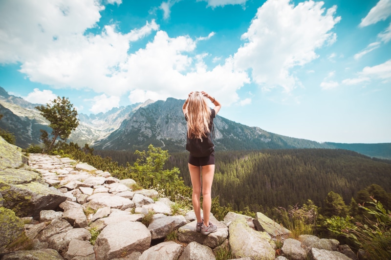 standing, hairstyle, looking at view, clouds, people, europe, rock - object, solid, fresh air, slovakia, cloudy, scenery, outdoors, rear view, young, one person