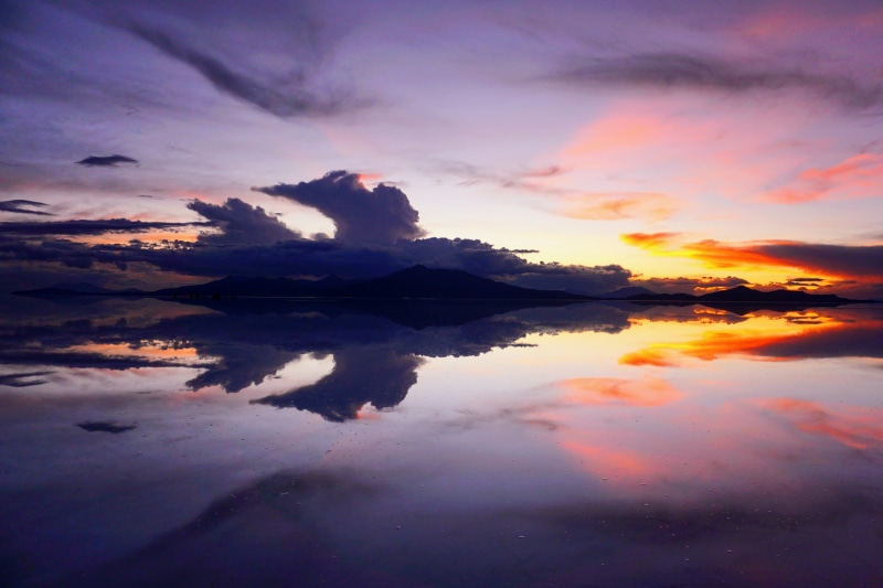 orange color, no people, Salar de Uyuni, beauty in nature, sky, calm, sunrise, waterfront, standing water, idyllic, dramatic, cloud - sky, tranquility