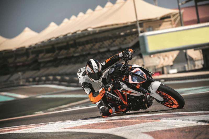 city, one person, real people, building exterior, transportation, outdoors, architecture, KTM 1290 Super Duke, headwear, nature, land vehicle, helmet, KTM
