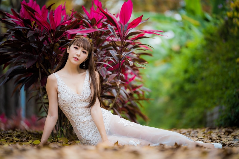 model, clothing, long hair, dress, beauty, plant, looking at viewer, depth of field, real people, Asian, young adult, beautiful woman, adult, plants, hair