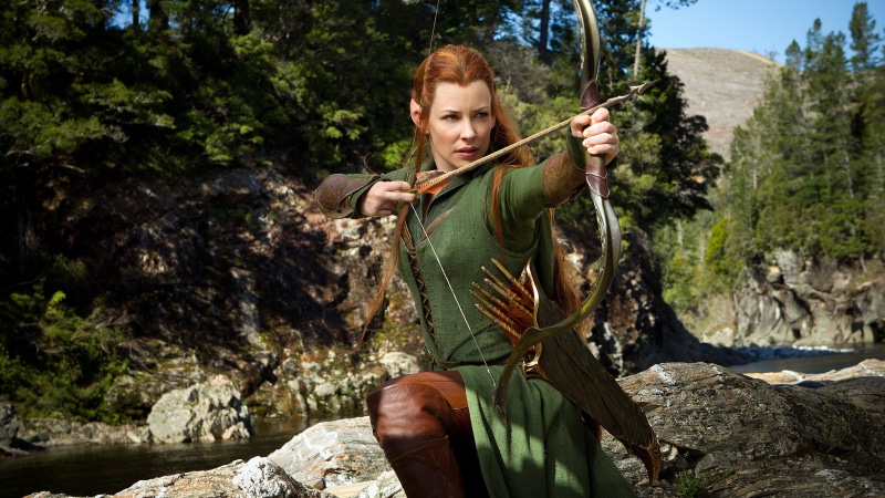 The Hobbit, outdoors, holding, sunlight, Tauriel, tree, leisure activity, redhead, front view, Evangeline Lilly, lifestyles, 4K, plant, portrait, rock - object