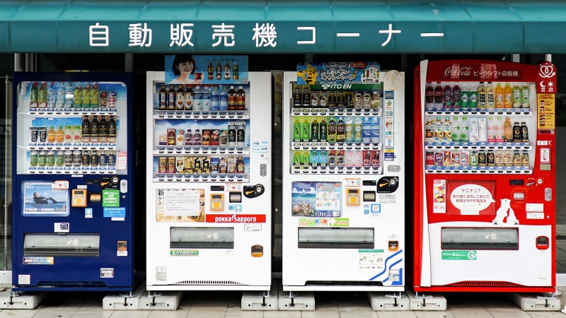 consumerism, large group of objects, restaurant, beverage, text, electronics, vending, japan, market, outdoors, blue, word, red, script, in a row, soda
