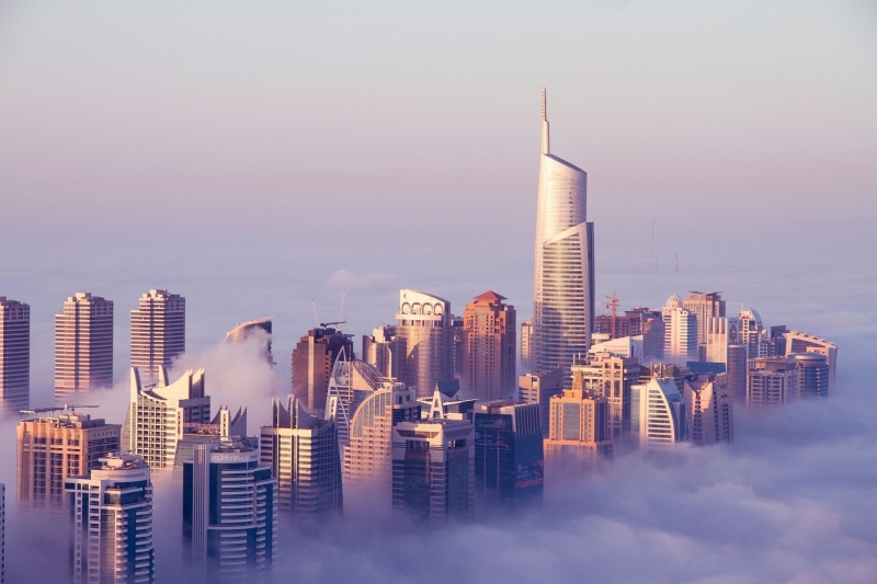 urban skyline, rise, tall - high, cityscape, financial district, no people, tower, building, clouds, mist, sky, high, sunset, modern, city life, Dubai