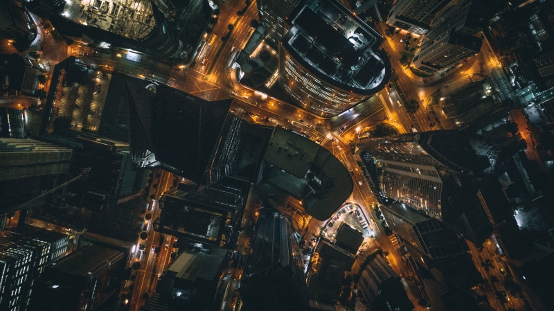 city life, night, city, architecture, illuminated, travel destinations, building exterior, bird, road, cityscape, eye, tall - high, building, aerial view