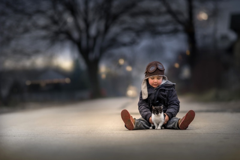 clothing, outdoors, street, shirt, s, dress, one person, mammal, portrait, looking at camera, city, children, warm clothing, innocence, nature, white, hood - clothing