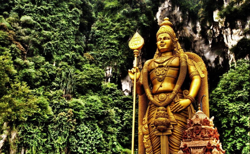 belief, green color, Malaysia, Statue, day, spirituality, creativity, tree, Temple, plant, Golden, building, sculpture, male likeness, no people, Murugan