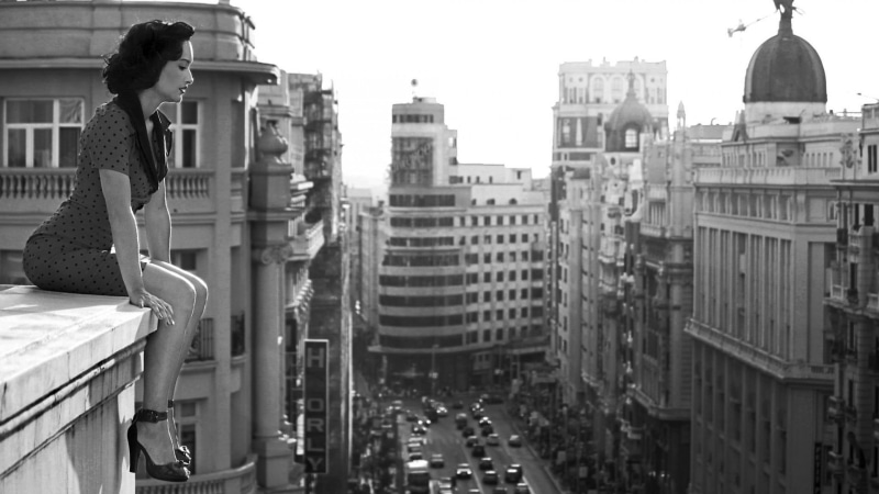 skyscraper, built structure, building exterior, monochrome, standing, high heels, casual clothing, architecture, lifestyles, sky, women, day, real people