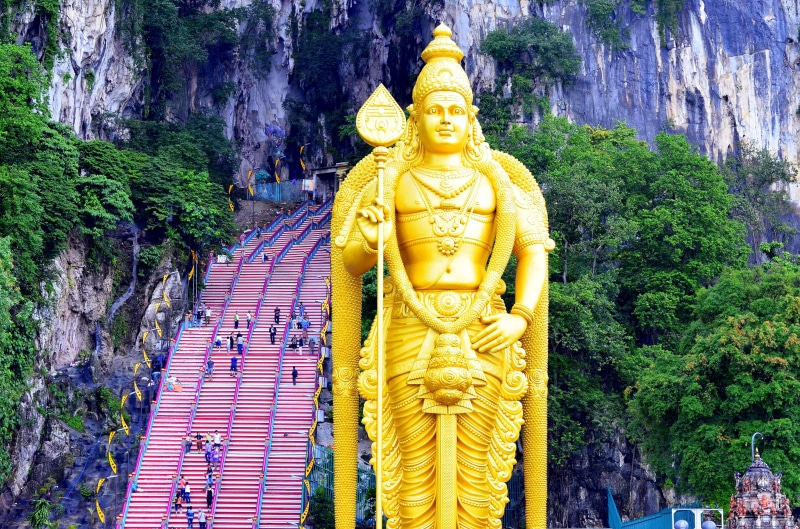 religion, golden, travel, batu caves, worship, kuala lumpur, shrine, plant, sculpture, metropolis, hindu, architecture, tree, male likeness, kuala, place of worship