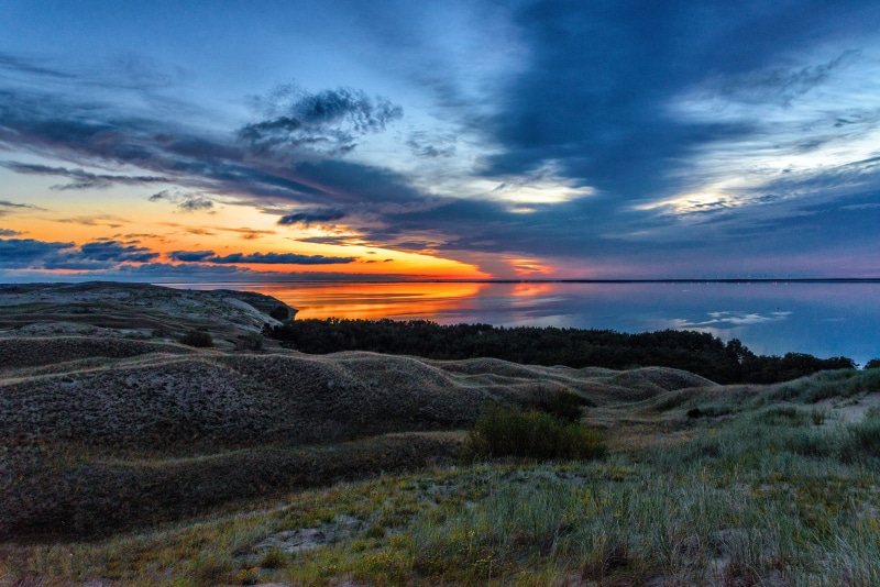 grass, oceanshore, scenic, non-urban scene, oceanside, nature photography, sunrise, tranquility, plant, orange color, idyllic, nature, sunset, water, clouds