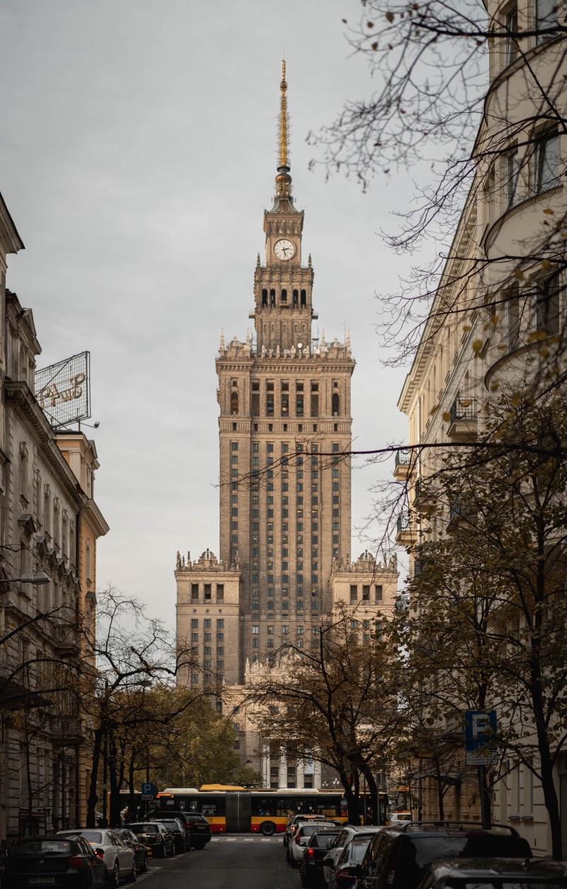 warsaw, building, transportation, day, steeple, spire, bus, town, science, motor vehicle, person, mode of transportation, incidental people, nature, building exterior