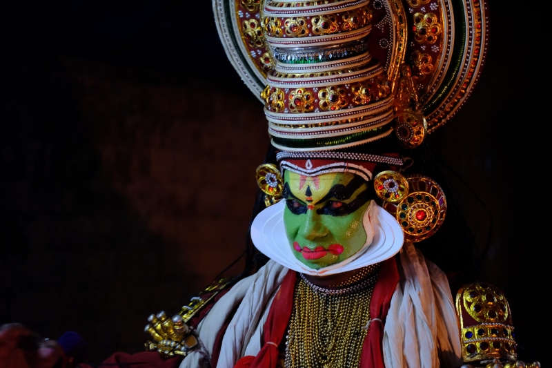 peopleandculture, kerala, painting, indoors, statue, no people, dance, ornaments, multi colored, face, black background, representation, male likeness