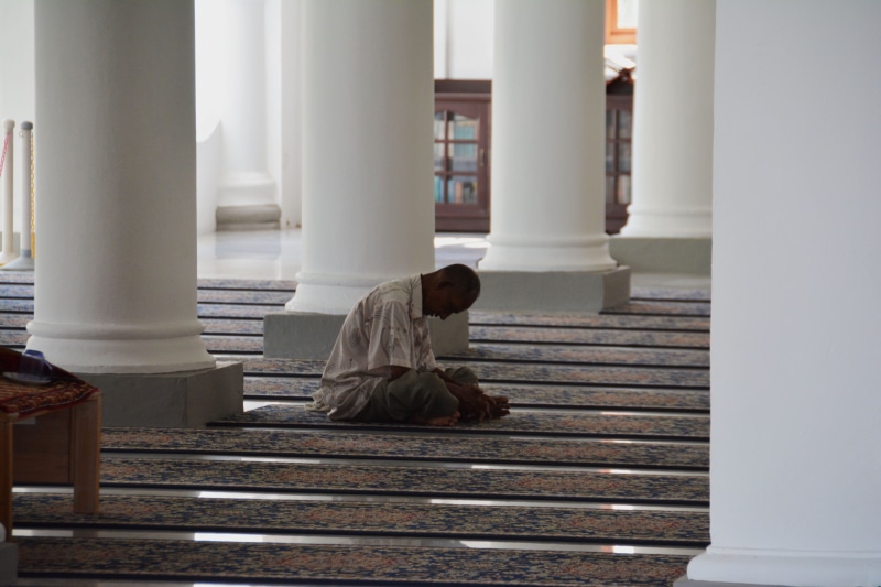 spiritual, architecture, domestic cat, sitting, man, 5K, person, islamic, concrete, brown, staircase, one person, praying, religious, prayer, lifestyles