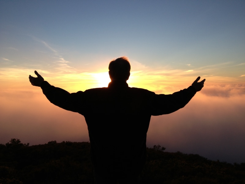 peace, freedom, people, beauty in nature, real people, dawn, lifestyles, man, back Lit, praying, sunset, prayer, limb, spreading, men, three quarter length