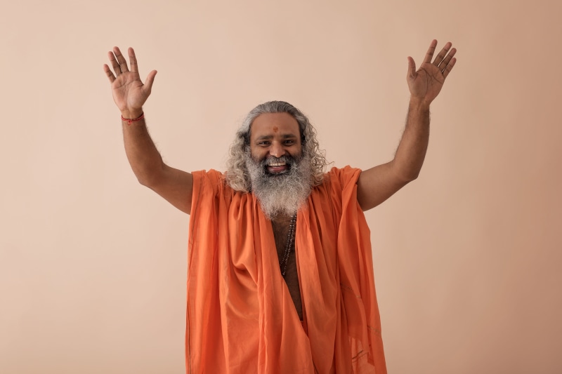 god, studio shot, standing, baba, indoors, adult, arms raised, human limb, human body part, inciation, mantra, human arm, waist up, guru, 5K, colored background