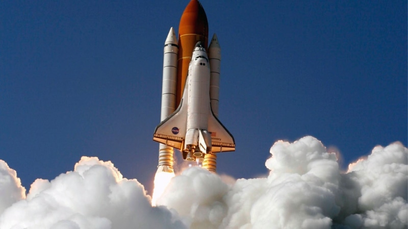 airplane, building exterior, outdoors, white color, white, mode of transportation, transportation, 720P, low angle view, blue, space shuttle, air vehicle