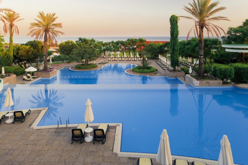 outdoors, architecture, blue, recreational Pursuit, patio, palm trees, no People, relaxation, 4K, tourist Resort, tourism, day, palm Tree, sky, swimming Pool