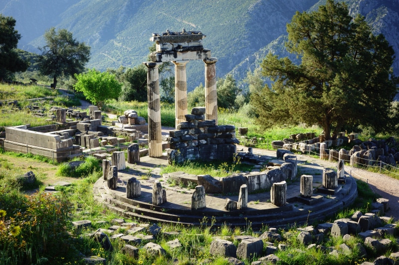 archaeology, tree, travel, architecture, sunlight, old ruin, travel destinations, delphi, history, architectural column, the past, no people, nature, place of worship