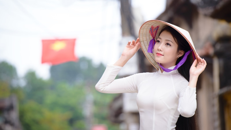 vietnamese, hat, standing, happiness, portrait, patriotism, focus on foreground, smiling, waist up, human arm, one person, day, innocence, nón lá, outdoors