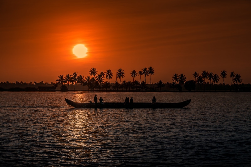 sunrise - Dawn, orange color, waterfront, aleppay, colorful, rowboat, beach, real people, dusk, kochi, coastline, sunset, outdoors, fishing, landscape