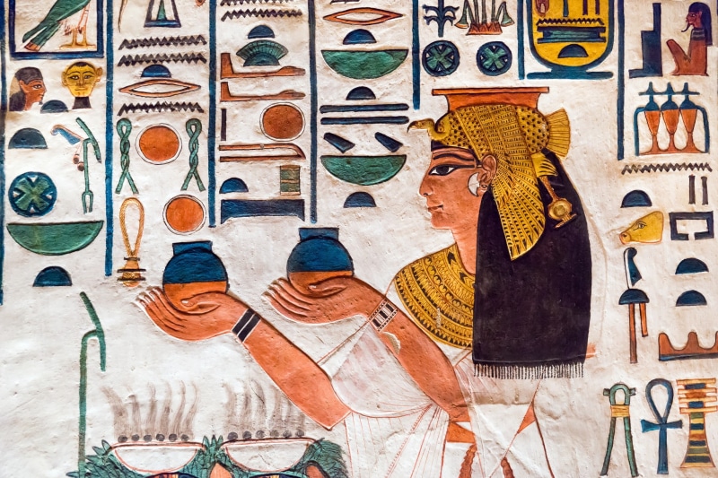 real people, creativity, variation, hieroglyphics, rear view, multi colored, adult, day, Egypt, clothing, men, wall - building feature, for sale, human representation