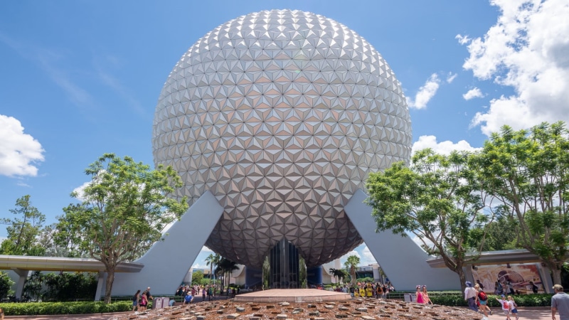 tree, incidental people, day, travel destinations, spirituality, place of worship, epcot, built structure, modern, walt disney world, skyscraper, belief