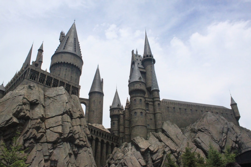travel, building exterior, cloud - sky, low angle view, castle, the past, spire, outdoors, built structure, gothic style, sky, Hogwarts, nature, no people