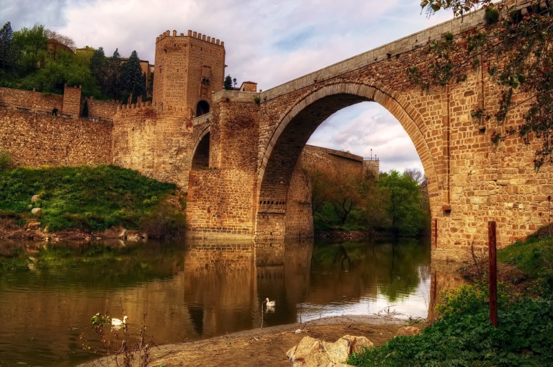 cloud - sky, the past, swan, building exterior, arch bridge, castle, tower, day, building, stoned, arch, history, built structure, ruined, reflection, clouds