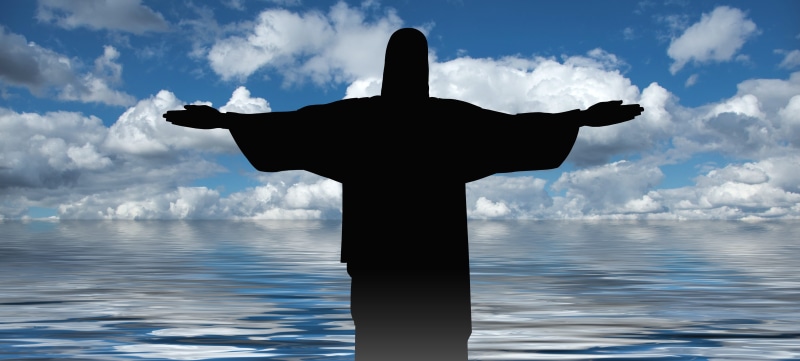 outdoors, sea, cloud - sky, religion, statue, sky, spirituality, church, sculpture, crucifixion, gesturing, representation, architecture, silhouette, day