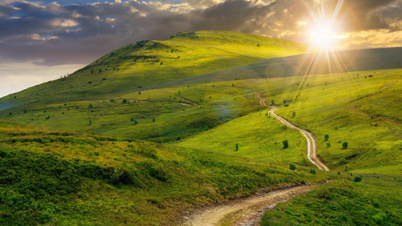 green color, mount scenery, sun, rays, grass, environment, happiness, sunshine, nature, sunset, green, sunbeam, field, outdoors, no people, mountainous landforms