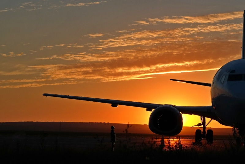 dusk, commercial airplane, romantic sky, air vehicle, sunrise, orange color, aircraft wing, transportation, mode of transportation, airport, journey, airplane