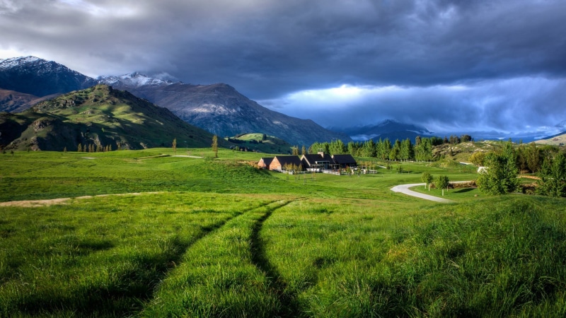 cloud - sky, mountain, agriculture, road, beauty in nature, architecture, field, no people, mountain range, outdoors, landscape, sky, green color, scenics - nature
