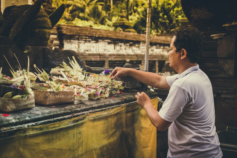 symbol, three quarter length, silence, sign, men, white, market, ceremony, side view, food, pray, bali, festival, tradition, spiritual, for sale, local