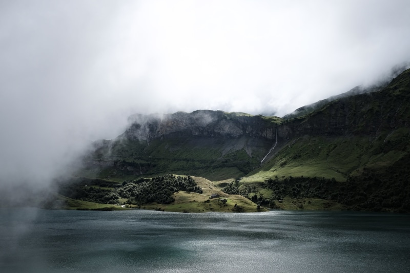 brown, fog, outdoors, clouds, ocean, sky, tranquility, rocks, mountain, land, sea, eerie, nature, beach, covered, vegetation, power in nature, trees, horizon