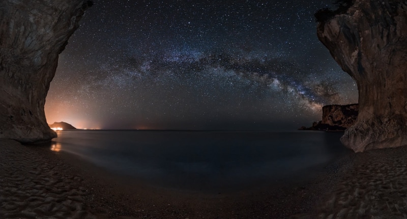 night, beauty in nature, rock - object, galaxy, horizon over water, tranquility, sea, tranquil scene, sky, cave, star - space, Milky Way, seashore, beach