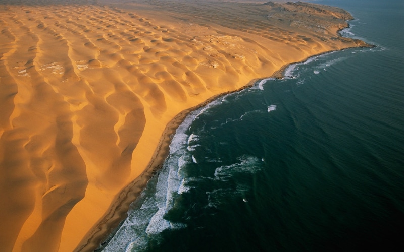 tranquil scene, high angle view, no people, landscape, motion, Namibia, aerial view, desert, sea, beauty in nature, non-urban scene, solid, power in nature