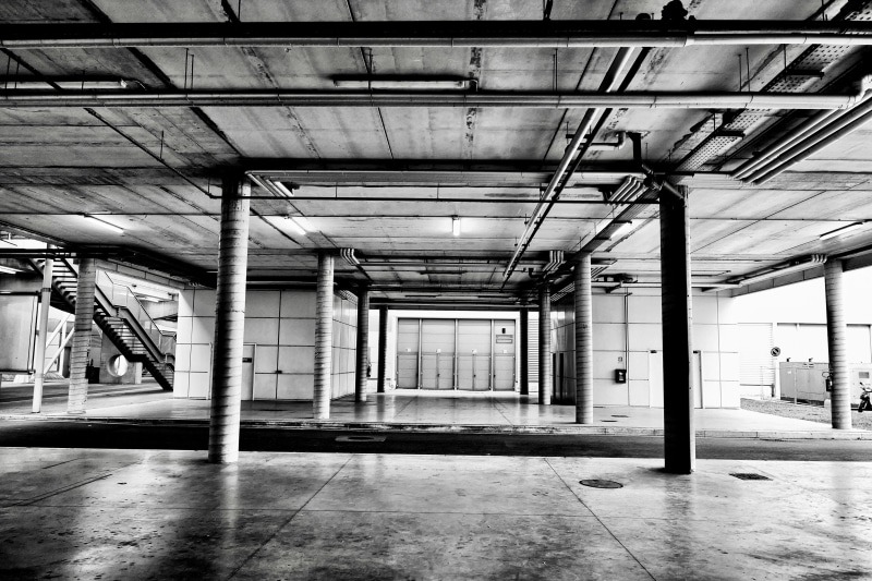 corridor, empty, parking lot, illuminated, town, architectural column, concrete, building, column, room, built structure, industry, nuova fiera di roma