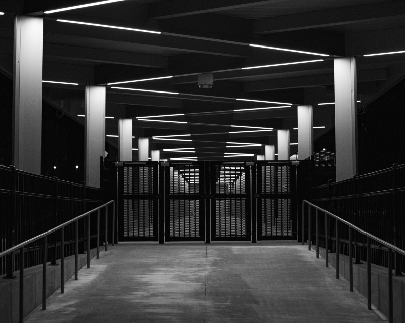 night, museum, subway, pub, absence, direction, no people, silhouette, floor, railing, railings, fluorescent light, gate, stage, indoors, architecture