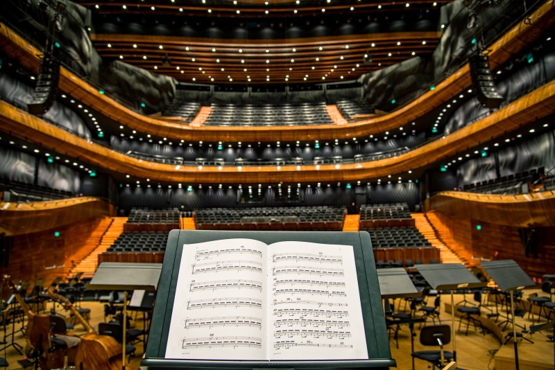 notes, classical music, white, music, sheet music, chairs, belief, musical instrument, orchestra, equipment, near, no people, stage, musical, sheet, book