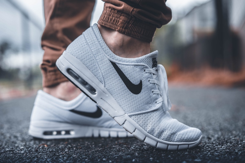 sneaker, exercise, running shoe, two people, human limb, person, standing, runner, tone, 5K, selective focus, black, wearing, running, feet, clothing
