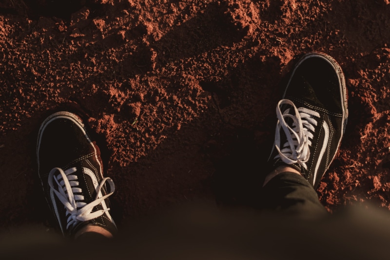 running shoe, human body part, limb, sunrise, nature, men, standing, lifestyles, running, apparel, sneaker, person, low section, directly above, clothing