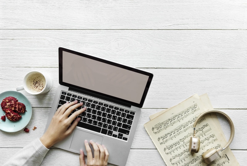 cookie, publication, hobby, searching, composer, copy space, flat lay, notes, communication, paper, device, person, notebook, laptop, music, computer, wood - material