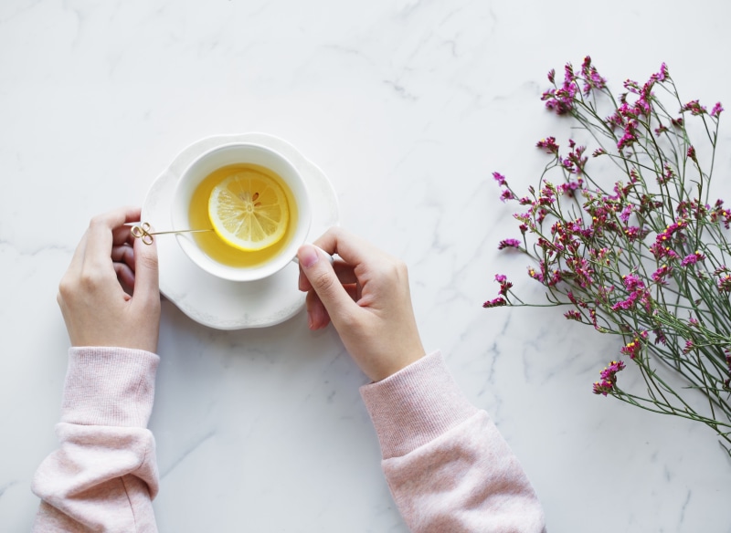pretty, lifestyles, refreshment, tea - hot drink, marble, afternoon, one person, girly, aerial, routine, flowering plant, real people, white, tea cup, clean