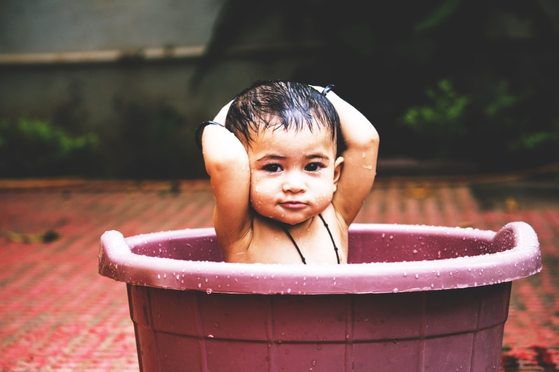 taking a bath, people, child, day, looking at camera, happiness, focus on foreground, fun, innocence, boys, bathing, outdoors, cleaning, girls, real people