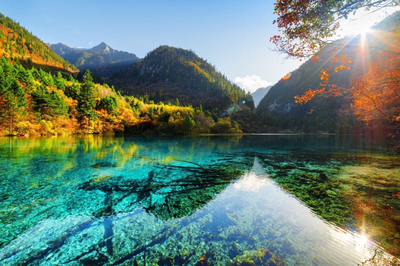 no people, sunlight, lake, mountain, beauty in nature, non-urban scene, idyllic, nature, outdoors, autumn, plant, tranquility, water, scenics - nature