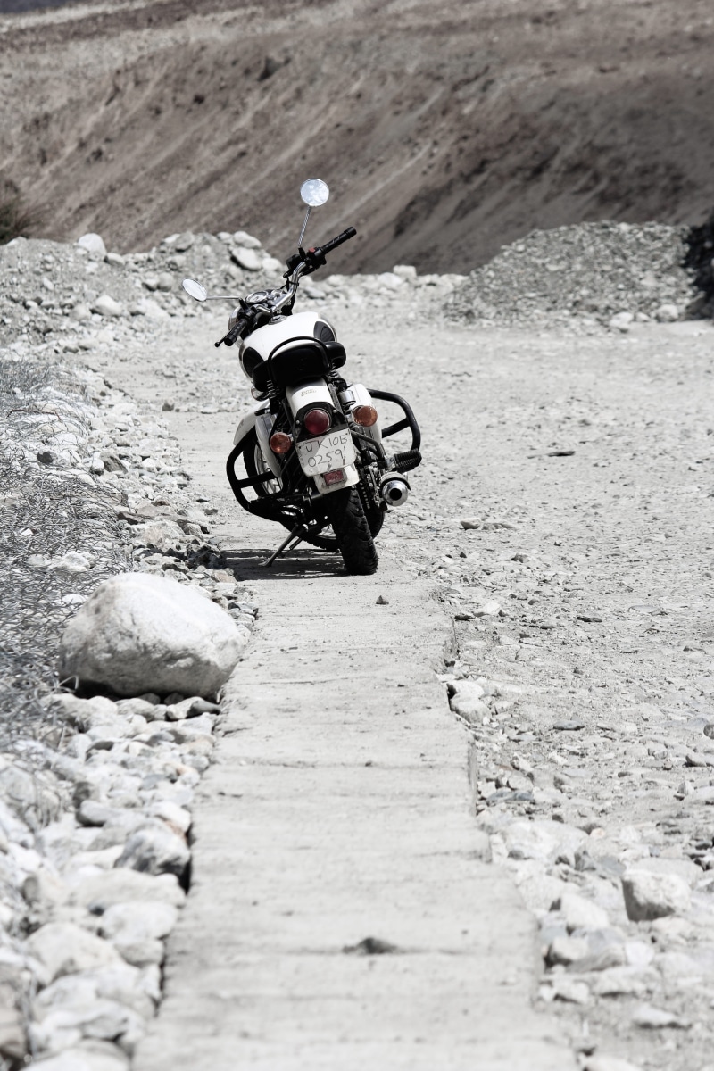 helmet, leh, motorcycle, land, real people, men, land vehicle, day, field, transportation, bike, one person, mode of transportation, sunlight, ladakh, outdoors