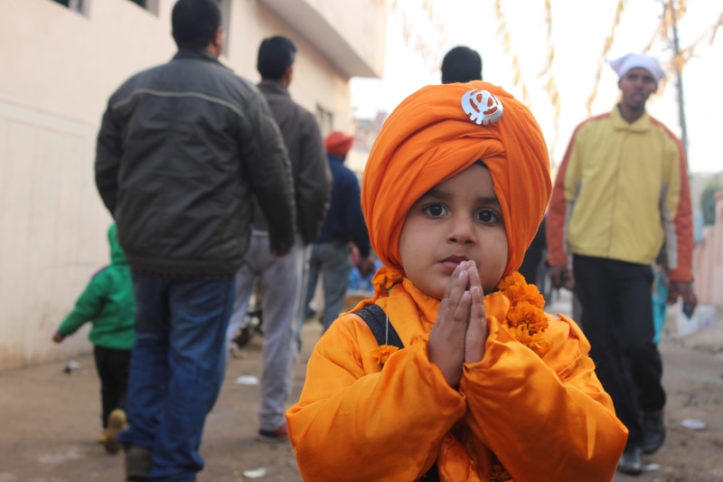 incidental people, holy, real people, boy, pumpkin, punjab, standing, sikh, group of people, child, food, orange color, patiala, day, males, halloween
