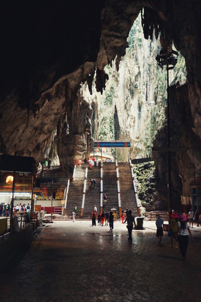 building, architecture, cave, travel, outdoors, building exterior, women, group of people, city, nature, malaysia, built structure, travel destinations