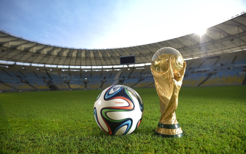 2K, soccer ball, focus on foreground, stadium, sport, soccer, sunlight, nature, team sport, plant, balls, grass, sky, no people, orange, field, green color