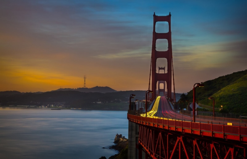 orange color, mountain, beauty in nature, nature, San Francisco Bay, cloud - sky, river, travel destinations, water, building exterior, connection, bridge - man made structure