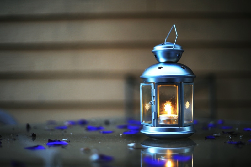 candle, indoors, full screen, fire, burning, table, lantern, focus on foreground, fullscreen, electric lamp, lighting equipment, container